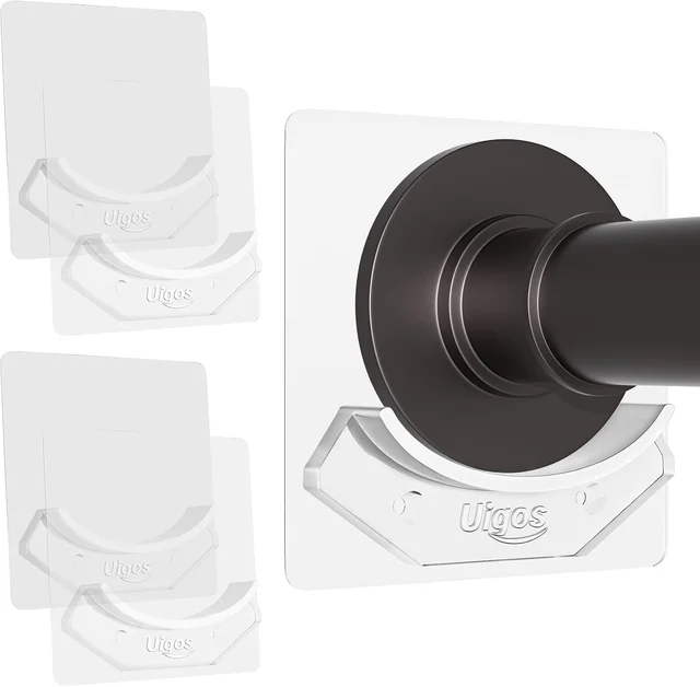 Four clear acrylic shower rod holders with an example rod end